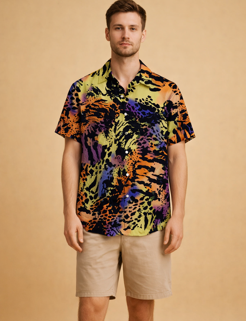 Short-sleeve button-up shirt with a bold abstract animal-inspired pattern in layered dark and vibrant tones, styled with tailored knee-length shorts featuring a clean straight fit and smooth finish.
