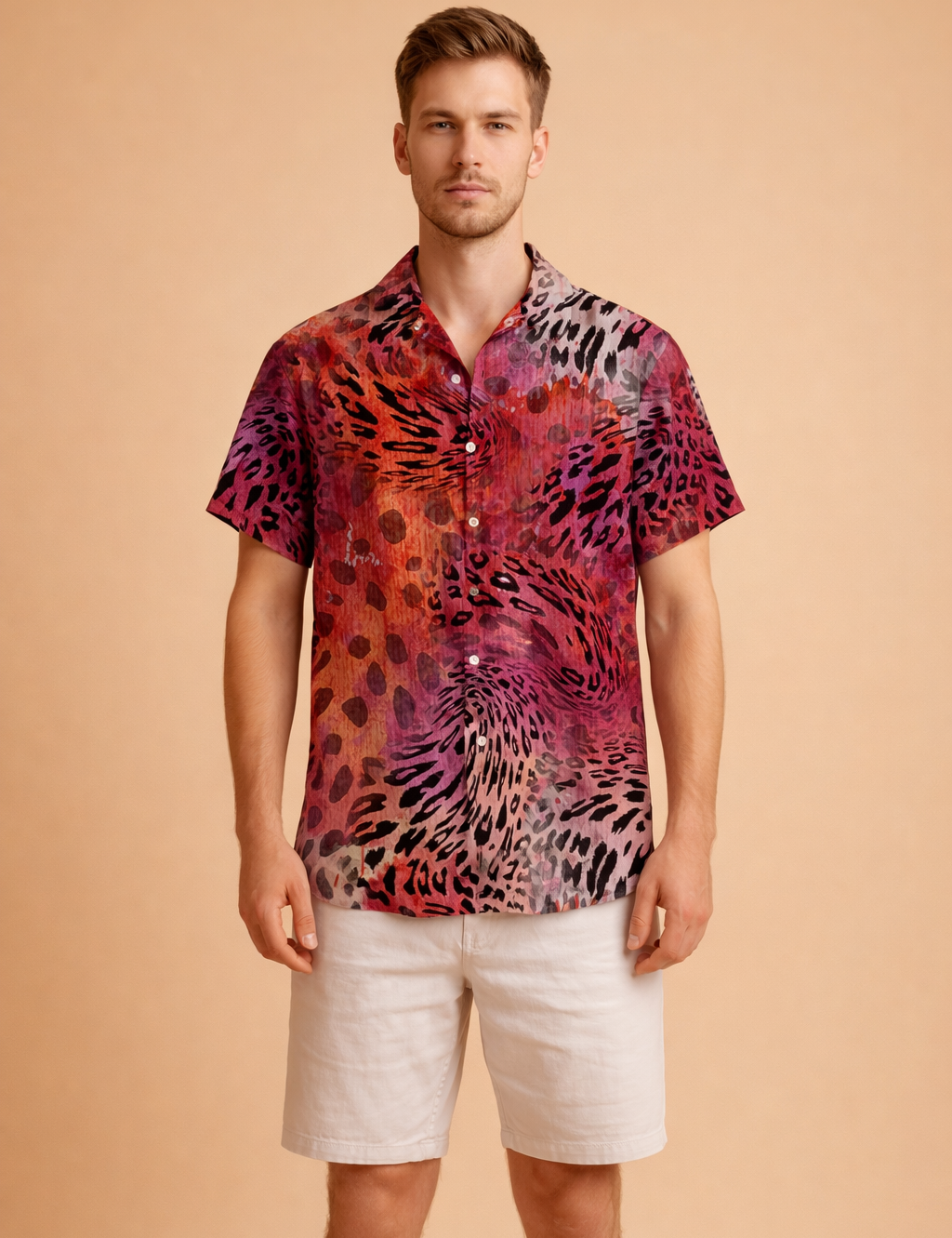 Short-sleeve button-up shirt with a bold abstract animal-inspired pattern in deep red, burgundy, black, and muted beige tones, featuring a relaxed collar and straight hem, styled with clean white knee-length tailored shorts.
