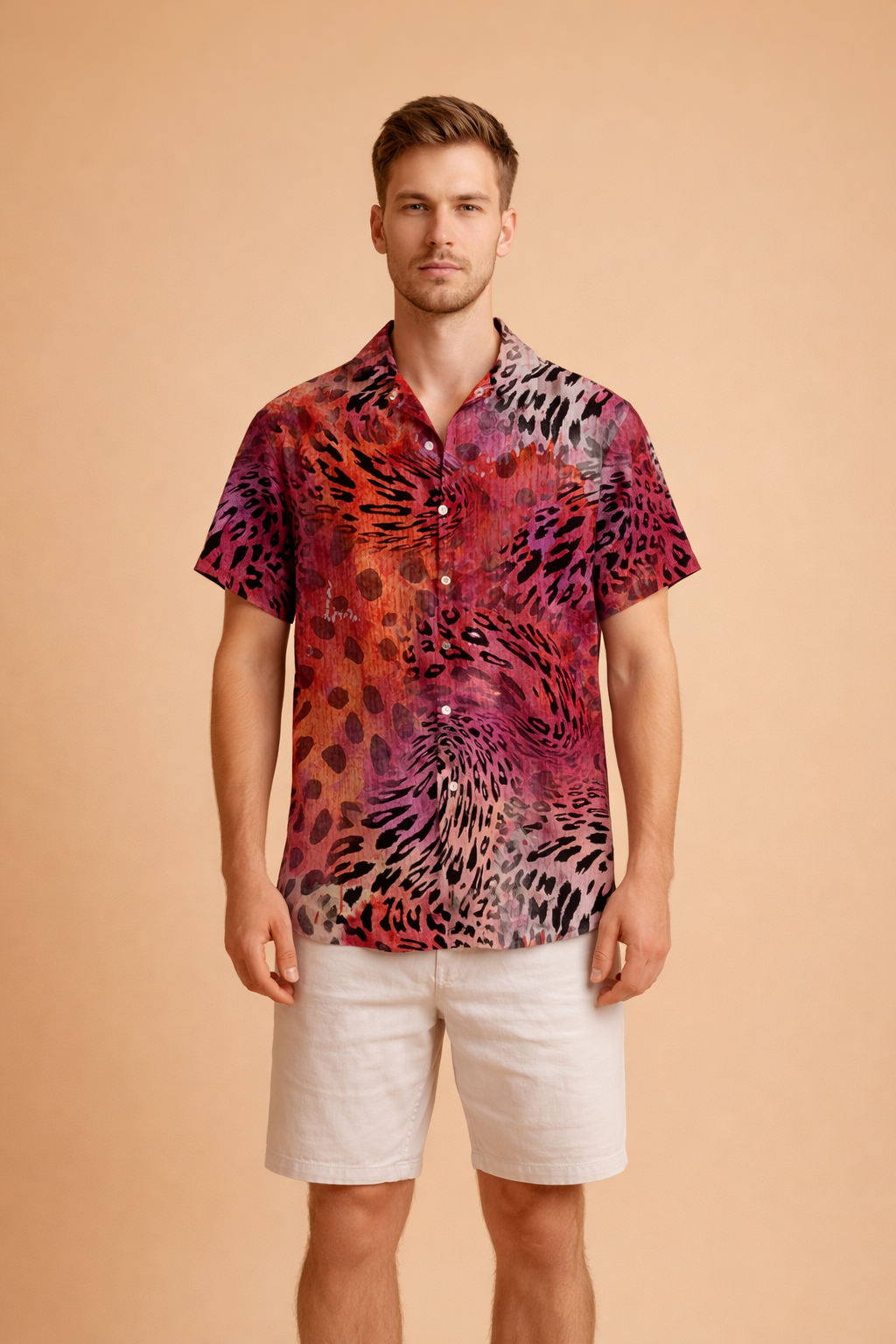 Short-sleeve button-up shirt with a bold abstract animal-inspired pattern in deep red, burgundy, black, and muted beige tones, featuring a relaxed collar and straight hem, styled with clean white knee-length tailored shorts.
