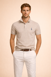 Beige short-sleeve polo shirt with a structured collar, two-button placket, tailored fit, and subtle embroidered chest logo, styled for a clean modern look.
