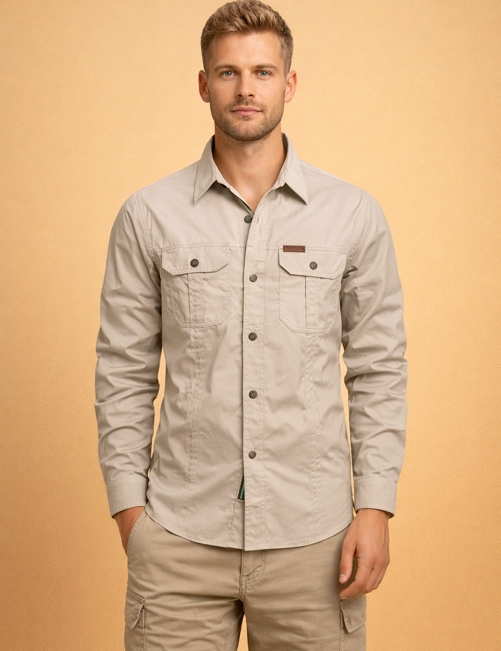 Beige long-sleeve button-up shirt with structured collar, front button closure, dual flap chest pockets with buttons, tailored straight fit, paired with beige cargo pants featuring side utility pockets and a clean modern cut