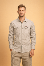 Beige long-sleeve button-up shirt with structured collar, front button closure, dual flap chest pockets with buttons, tailored straight fit, paired with beige cargo pants featuring side utility pockets and a clean modern cut
