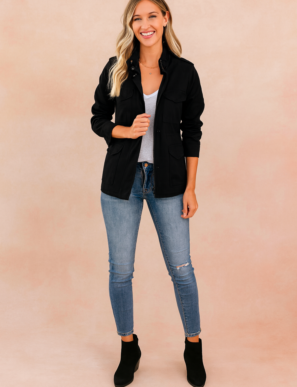 Black casual zipper jacket with long sleeves, flap chest pockets, button details, and a straight cut, styled with a white T-shirt and denim jeans.