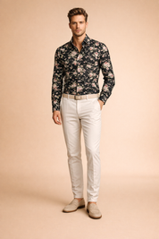Black long-sleeve button-up shirt with an all-over vintage floral print featuring soft pink, muted red, sage green, and cream blossoms on a deep black base, tailored in a clean modern fit and styled with classic neutral leather shoes for a refined contemporary look.