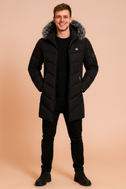 Men’s black quilted parka jacket with faux fur hood trim, diagonal stitching, multiple zipper pockets including red zip detail, and full-length insulated design for winter wear.
