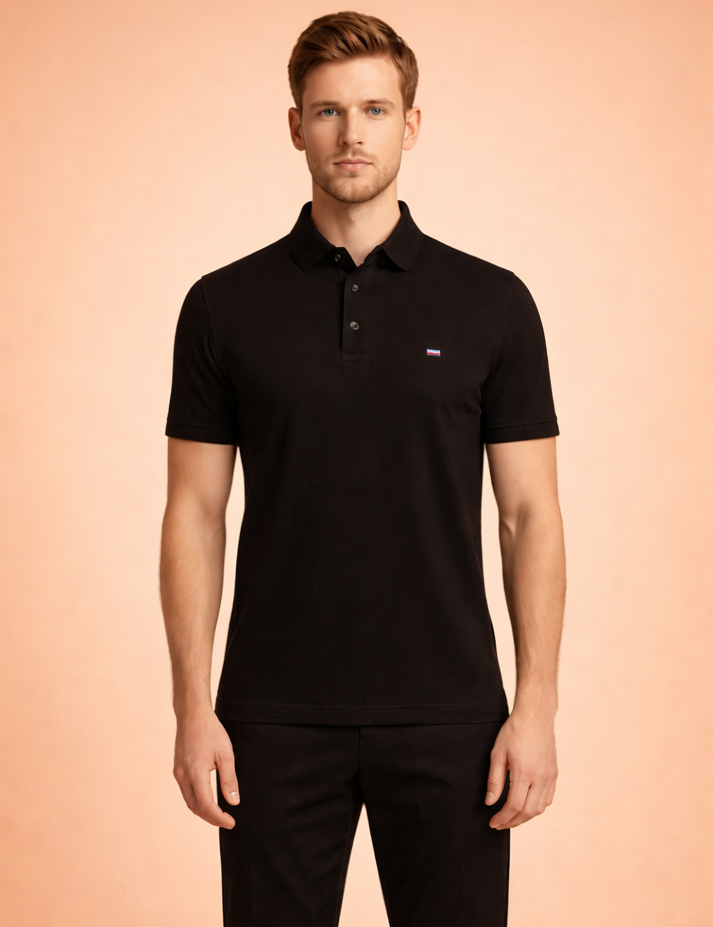 Black short-sleeve polo shirt with classic collar and button placket, finished with a subtle chest logo, styled with tailored black trousers for a clean, modern look.
