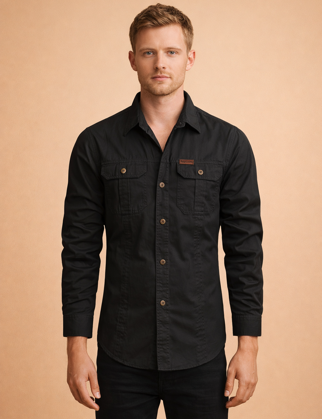 Structured black long-sleeve button-up utility shirt with dual flap chest pockets, contrast buttons, straight hemline, and a tailored regular fit suitable for everyday wear