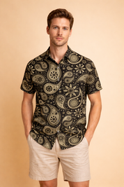Short-sleeve collared button-up shirt with an all-over bold animal-inspired abstract pattern combining organic and geometric motifs, finished with a front button closure and a relaxed, clean silhouette.