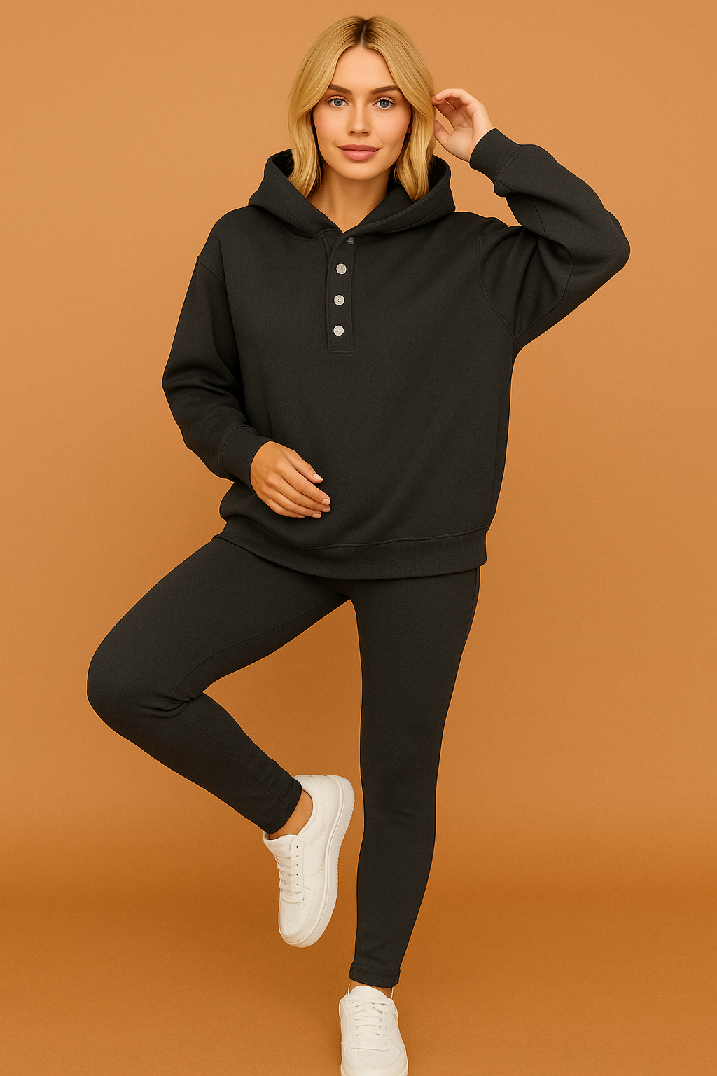 Charcoal gray plain hoodie and leggings loungewear set with silver front buttons, styled with classic white sneakers.