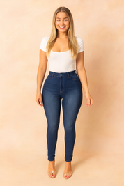 High-waisted skinny jeggings for women in dark blue denim with front button and zip closure, designed for a flattering slim fit and modern everyday wear.