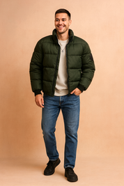 Dark green puffer jacket with a zip-up front, horizontal quilted stitching, and elastic cuffs designed for warmth and casual winter style.