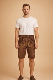 Traditional embroidered leather lederhosen shorts with decorative front flap, detailed alpine embroidery, side button accents, and matching belt with ornate buckle