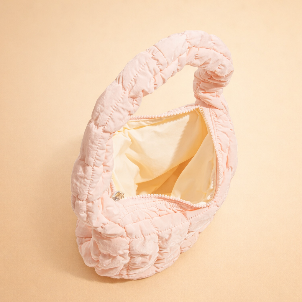 european-studio-model-shot-pink-quilted-hobo-bag-handheld.png