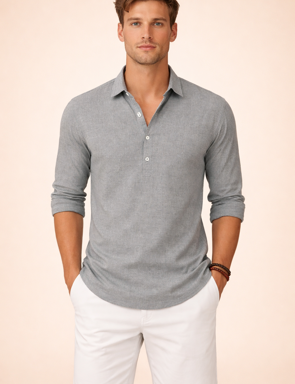 Long-sleeve henley-style shirt with a short button placket, open collar, rolled cuffs, smooth woven texture, relaxed tailored fit, and straight hem, paired with clean tailored shorts featuring a flat front and streamlined silhouette.