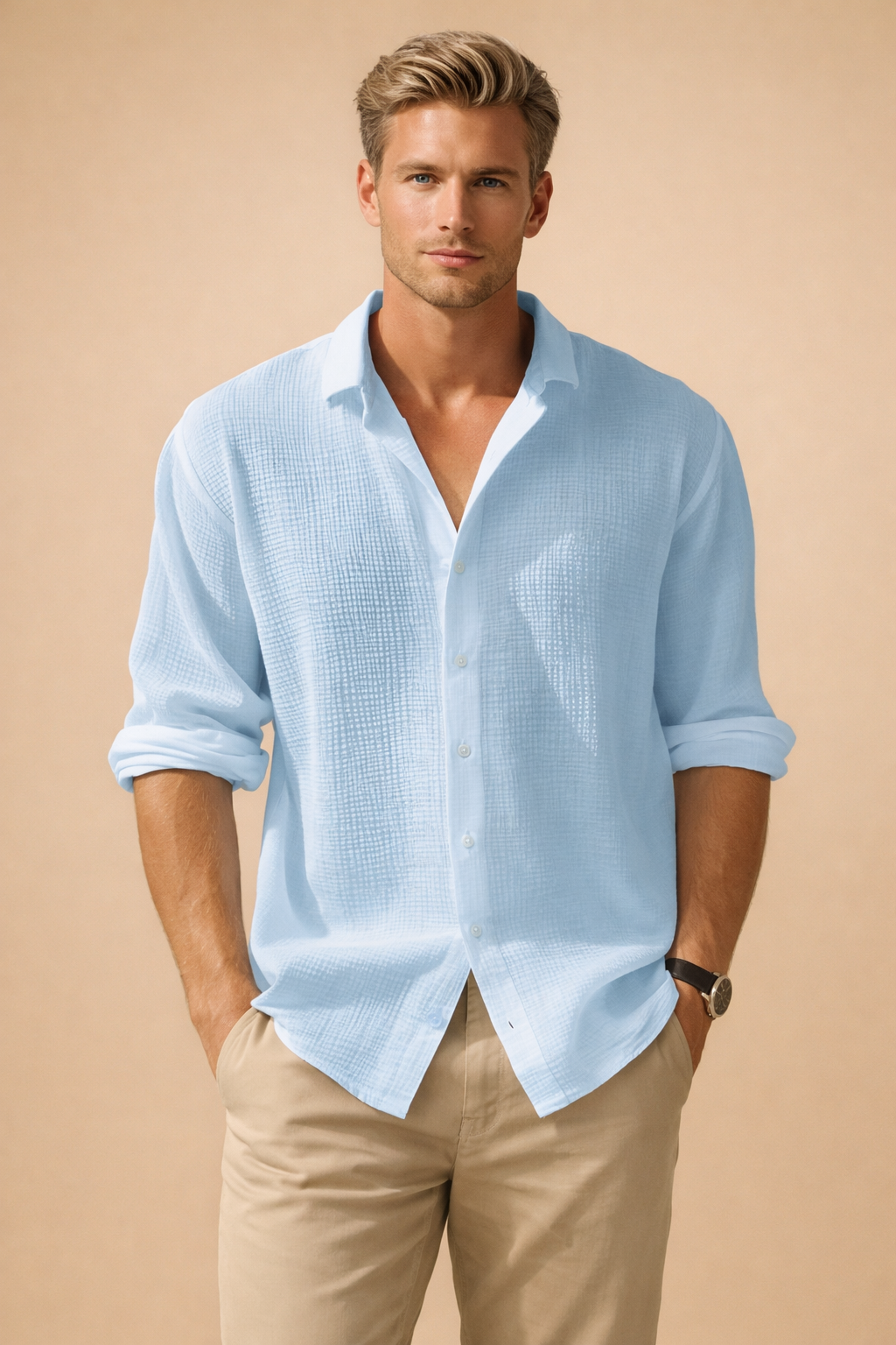 Light blue textured long-sleeve button-up shirt with a relaxed fit, open collar, and rolled cuffs, paired with slim beige trousers for a clean, modern look.