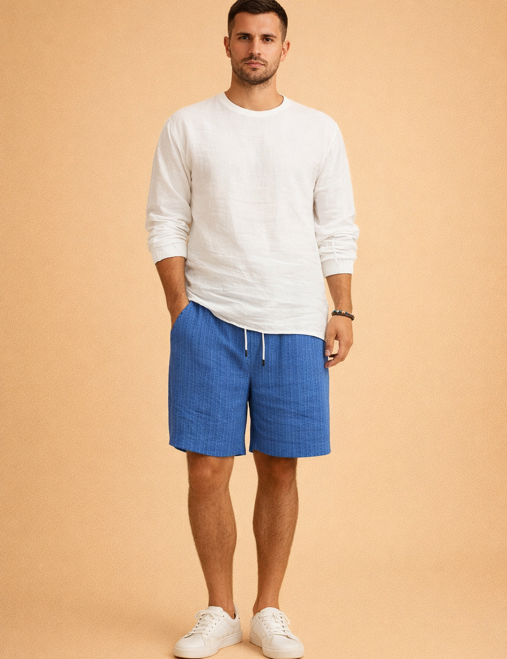 Men’s white long-sleeve casual shirt paired with blue vertically ribbed drawstring summer shorts and clean white low-top sneakers, featuring a relaxed modern fit and a textured fabric finish suitable for warm-weather styling.