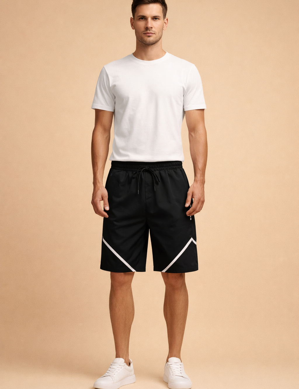 Black athletic drawstring shorts with smooth matte fabric, elastic waistband, adjustable black drawcord, straight knee-length cut, and crisp diagonal white reflective stripe detailing on both legs, paired with a fitted white short-sleeve crew-neck T-shirt in soft breathable fabric and minimalist white low-profile sneakers with a clean leather finish.