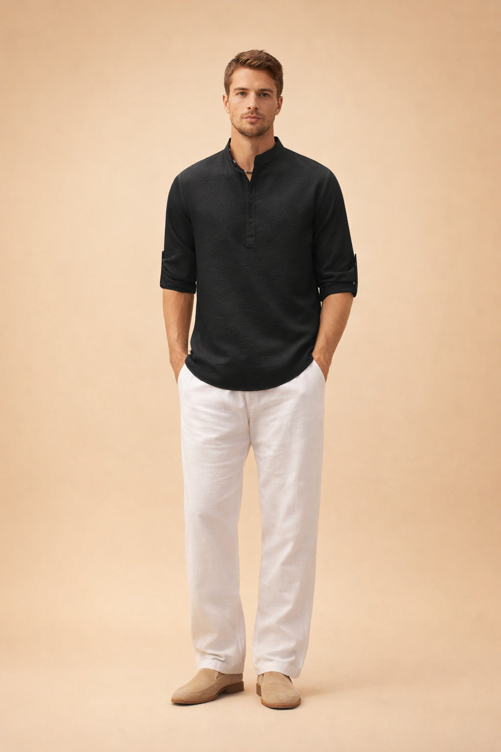 Men’s black textured long-sleeve shirt with mandarin collar and partial button placket, featuring a subtle woven pattern, relaxed fit, rolled cuffs, and clean drape paired with crisp white straight-leg trousers for a refined casual look