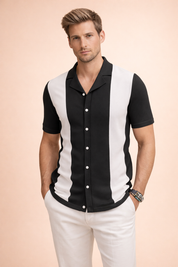 Black and white short-sleeve men’s button-up shirt with bold vertical panel design, open camp collar, clean front button closure, straight hem, and a tailored modern fit.
