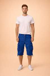 Blue cotton cargo shorts with multiple flap pockets and button details, paired with a plain white short-sleeve crew neck T-shirt and clean white low-top sneakers, showcasing a casual summer outfit with durable fabric texture and structured stitching.