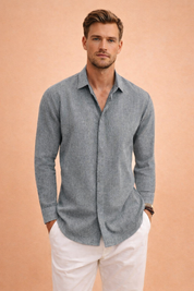 Men’s long-sleeve button-front shirt with a clean collar, straight hem, and relaxed tailored fit, paired with crisp slim-fit trousers for a refined casual look.