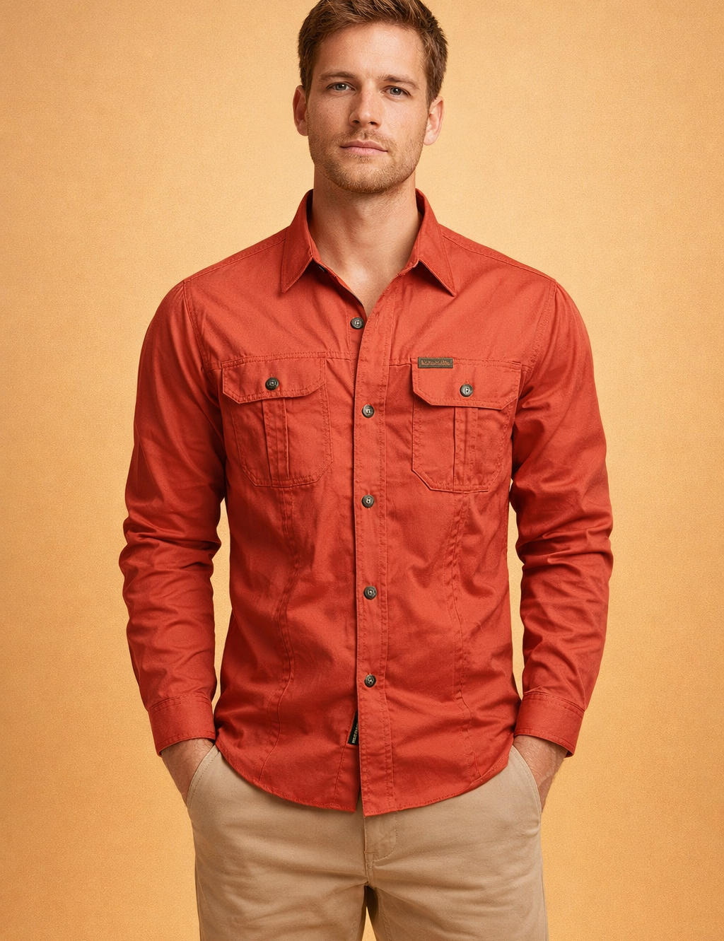 Long-sleeve button-up shirt with a structured collar, full front button closure, and two symmetrical chest flap pockets with button fastenings, paired with straight-leg tailored trousers for a clean, modern casual look.