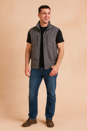 Stylish men's grey outdoor vest with multiple zipper pockets, designed for casual wear and functional layering.