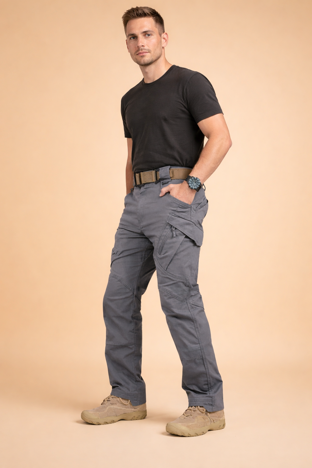 Men’s grey tactical cargo pants with straight-leg cut, reinforced seam panels, multi-functional side pockets with flap and zipper details, structured waistband with belt loops, and durable utilitarian design suitable for everyday wear.