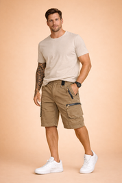 Men’s casual outdoor outfit featuring solid khaki utility cargo shorts made from durable matte fabric with multiple zippered and flap pockets, metal D-ring detail, reinforced stitching, and straight knee-length cut, paired with a solid olive green short-sleeve cotton T-shirt and dark open-toe outdoor sandals.