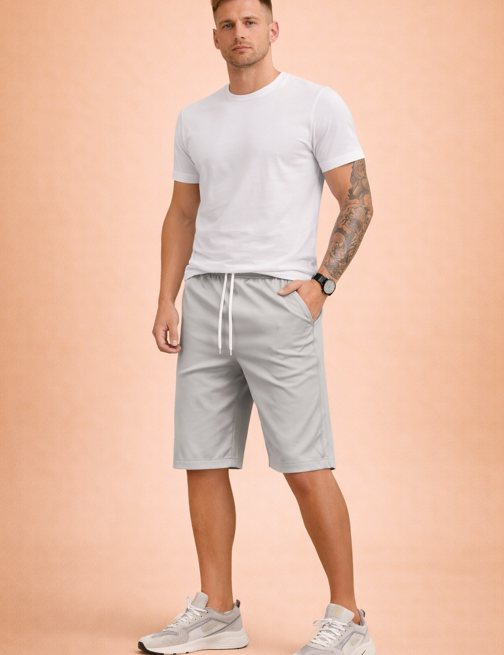 Men’s light grey casual summer shorts crafted from smooth woven cotton fabric with a matte finish, featuring a solid uniform grey tone, elastic waistband with white drawstring, relaxed straight-leg cut above the knee, clean stitched hems, and a minimal unpatterned surface with natural fabric folds.
