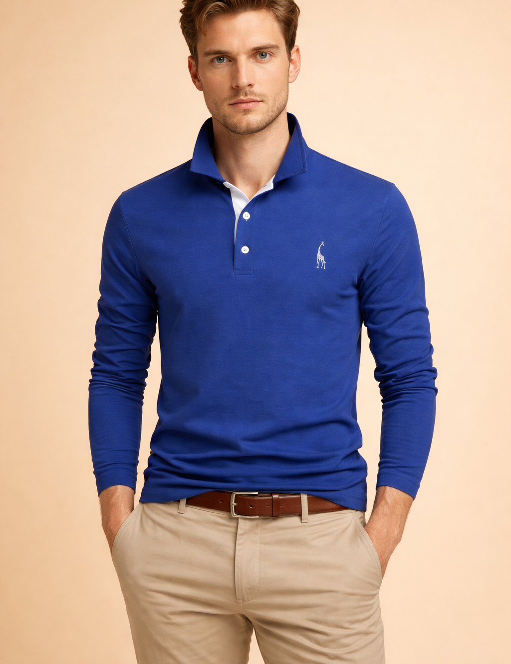 Men’s long-sleeve polo top with a clean structured silhouette, classic collar, button placket, and a subtle embroidered chest detail, styled with tailored beige trousers for a refined smart-casual look.