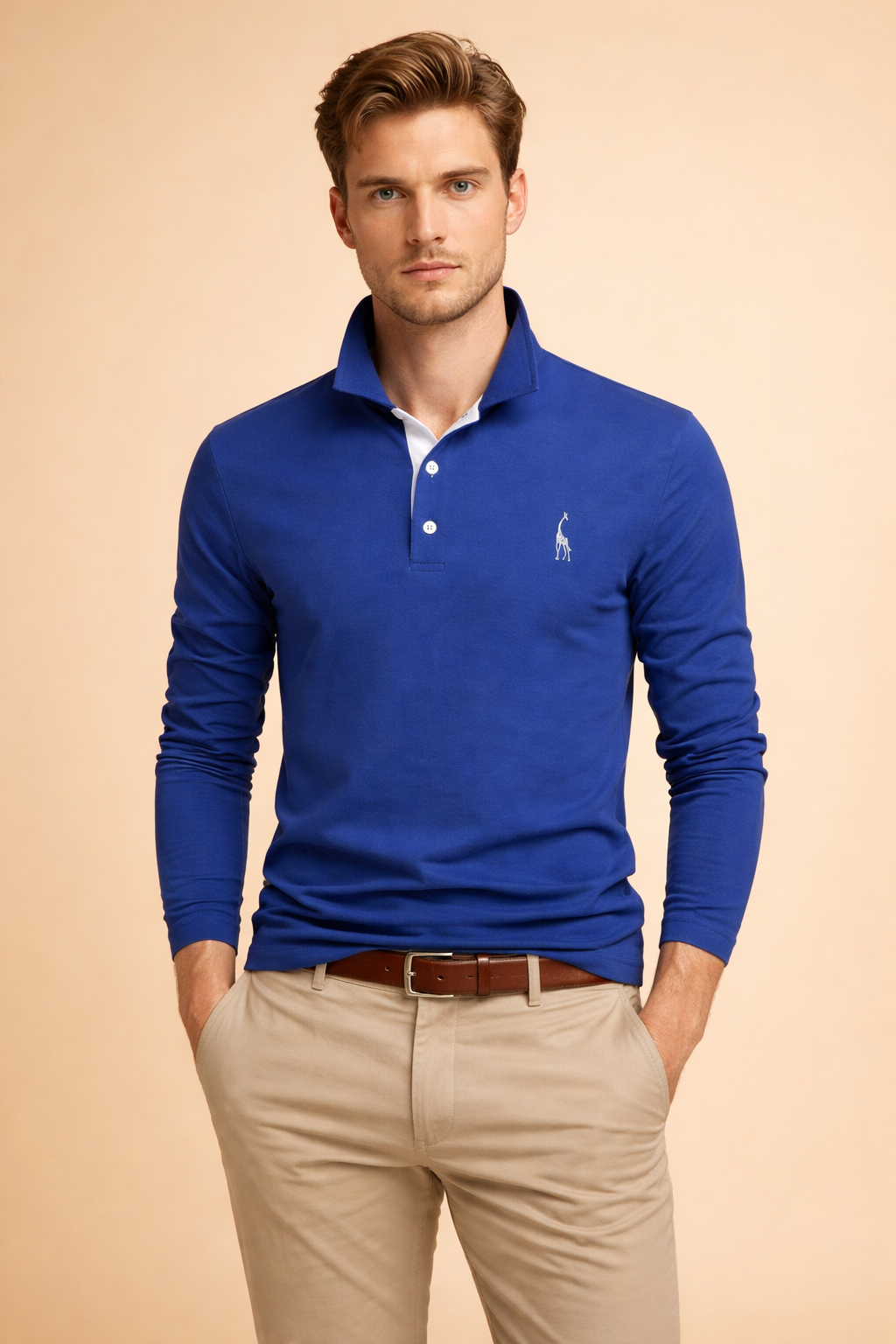 Men’s long-sleeve polo top with a clean structured silhouette, classic collar, button placket, and a subtle embroidered chest detail, styled with tailored beige trousers for a refined smart-casual look.
