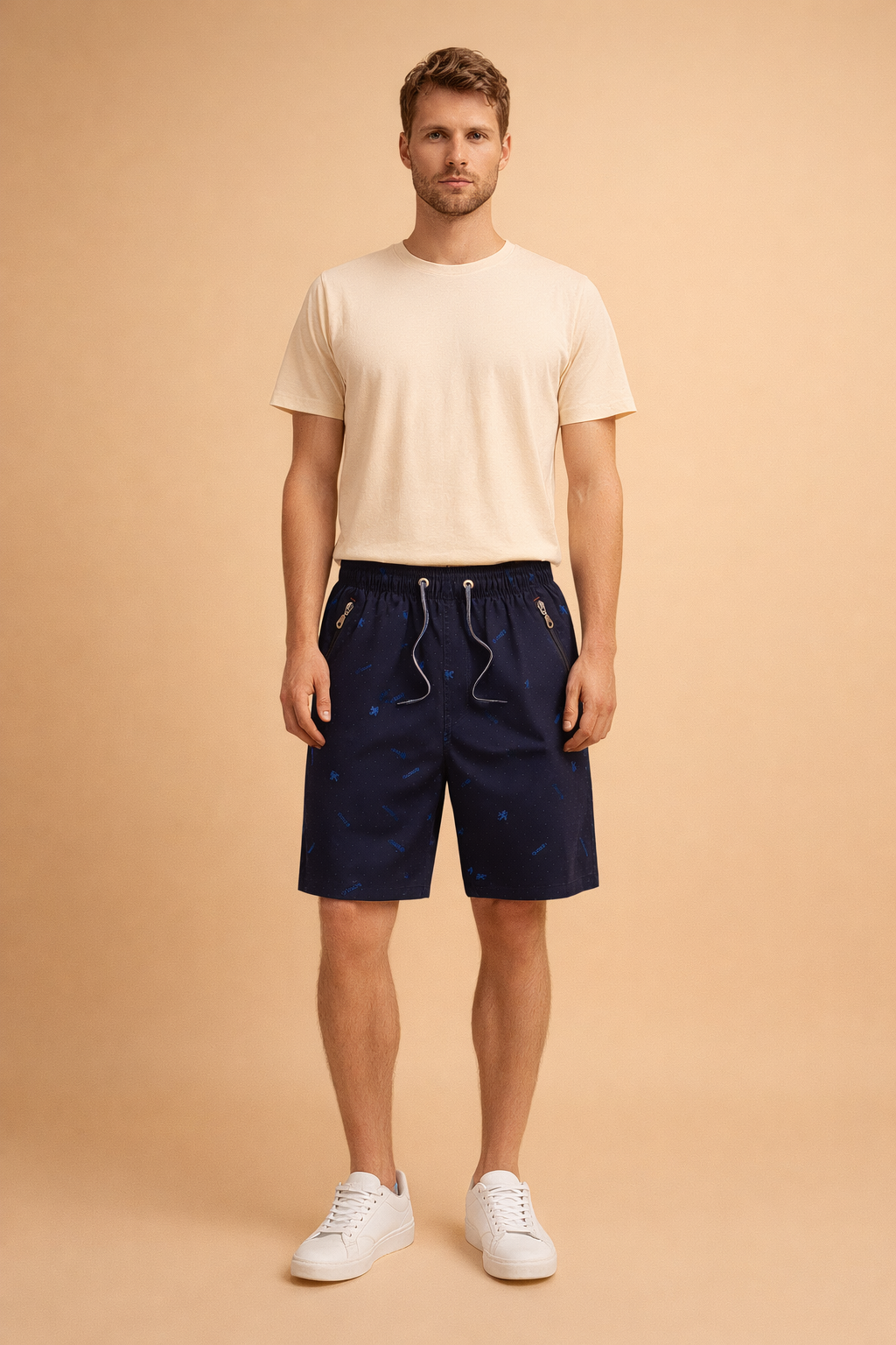 Navy blue men’s casual summer shorts with subtle all over micro dot pattern and small tonal graphic motifs, elastic waistband with drawstring, mid length relaxed fit, lightweight breathable fabric, zippered side pockets, smooth matte finish, tailored casual silhouette