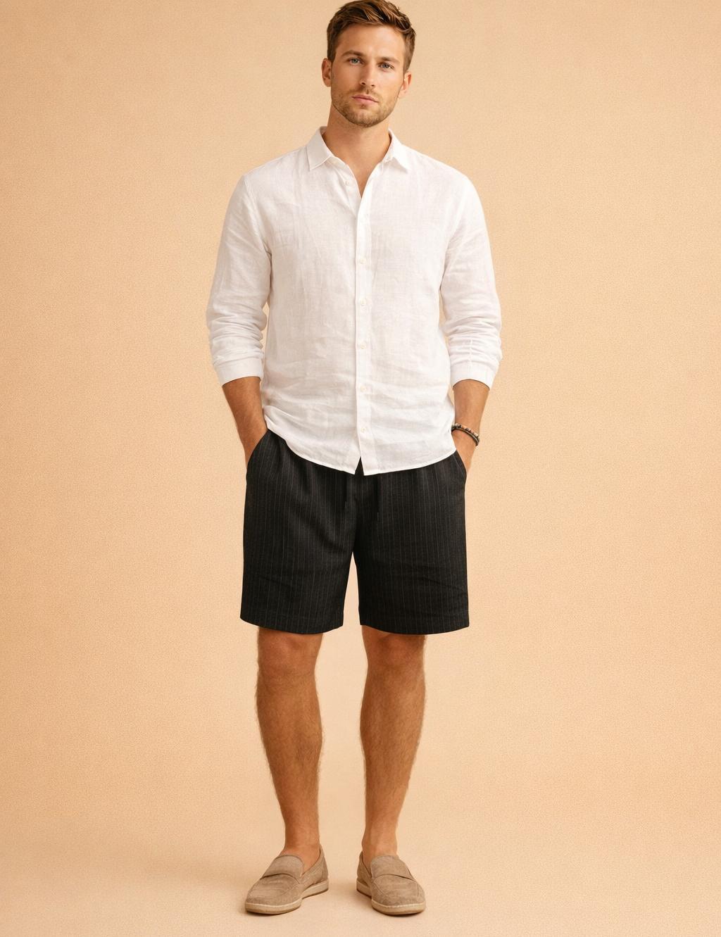 Men’s ribbed summer shorts with a clean vertical texture, tailored above-knee length, elastic waist with drawstring, styled with a crisp long-sleeve white shirt and neutral slip-on loafers for a refined casual look.