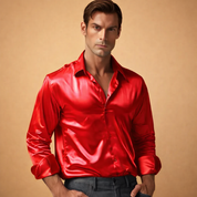 Men’s long-sleeve satin finish button-down shirt with a smooth glossy surface, classic collar, front button closure, and tailored fit, styled with straight-leg tailored trousers for an elegant evening look.