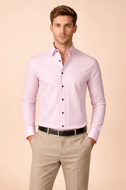 Slim-fit long-sleeve button-down shirt with a clean tailored cut, classic collar, smooth fabric drape, and contrasting dark buttons, styled with straight-leg tailored trousers and a minimalist belt for a refined smart-casual look.