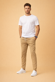 Slim-fit tailored trousers with a clean straight leg, paired with a minimalist short-sleeve crew-neck top and low-profile lace-up sneakers for a refined modern casual look.