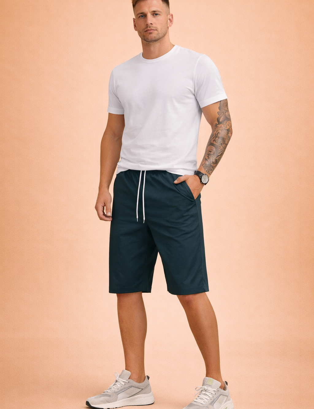 Mid-length men’s casual shorts in a deep teal blue shade, crafted from smooth woven fabric with a clean matte finish, featuring an elastic waistband with white drawstring, straight knee-length cut, minimal seam structure, and a lightweight summer drape paired with a solid short-sleeve crew-neck T-shirt in soft muted teal cotton jersey with a fine, even knit texture.
