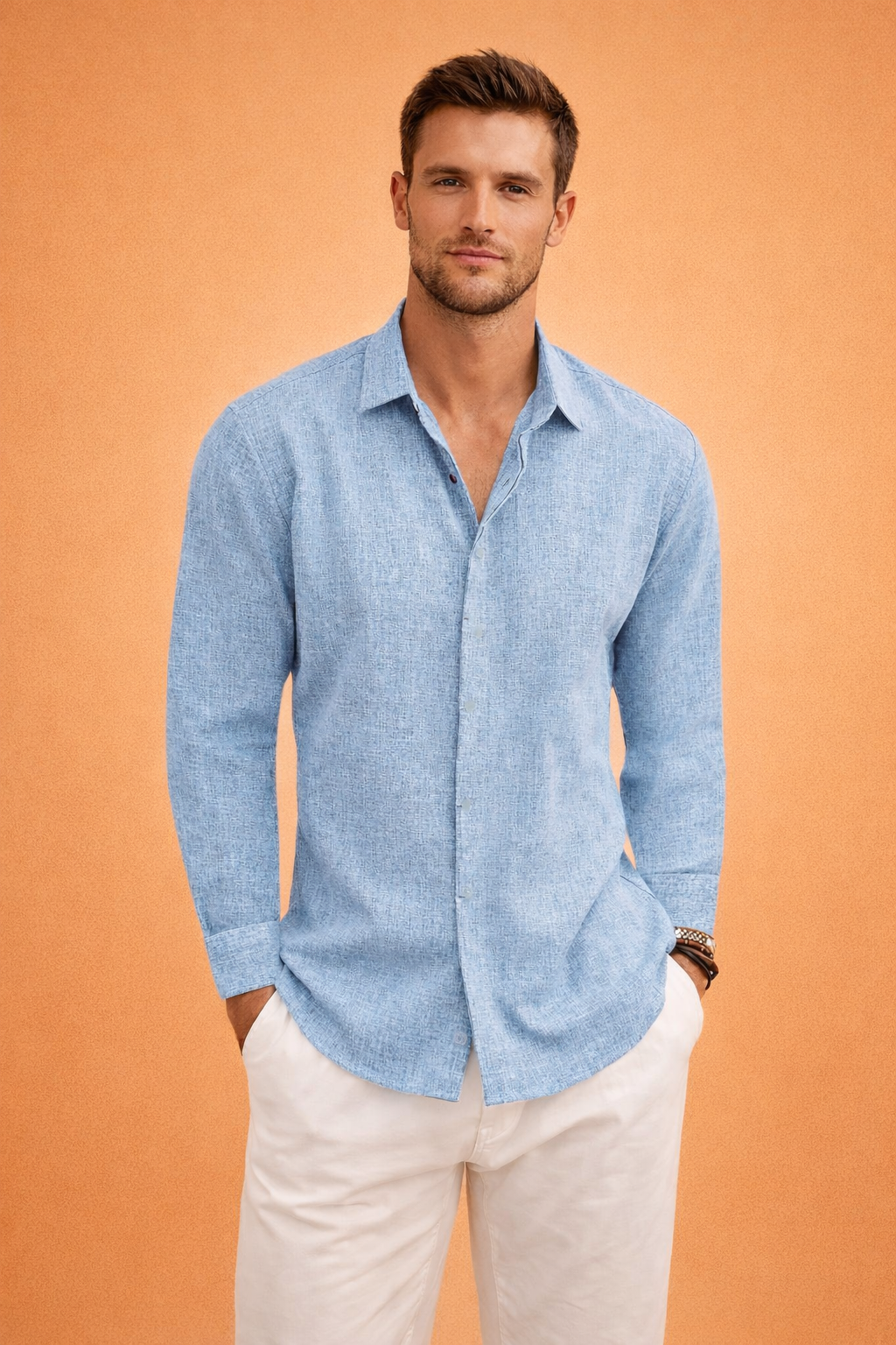 Textured long-sleeve button-front shirt with a relaxed open collar paired with clean straight-leg trousers for a refined casual look