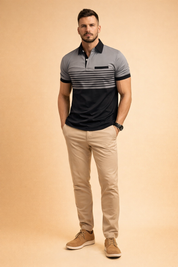 Two-tone short-sleeve polo shirt featuring a light grey upper panel, black lower panel, fine horizontal chest stripes, black collar and sleeve cuffs, paired with beige slim-fit trousers and clean black shoes.
