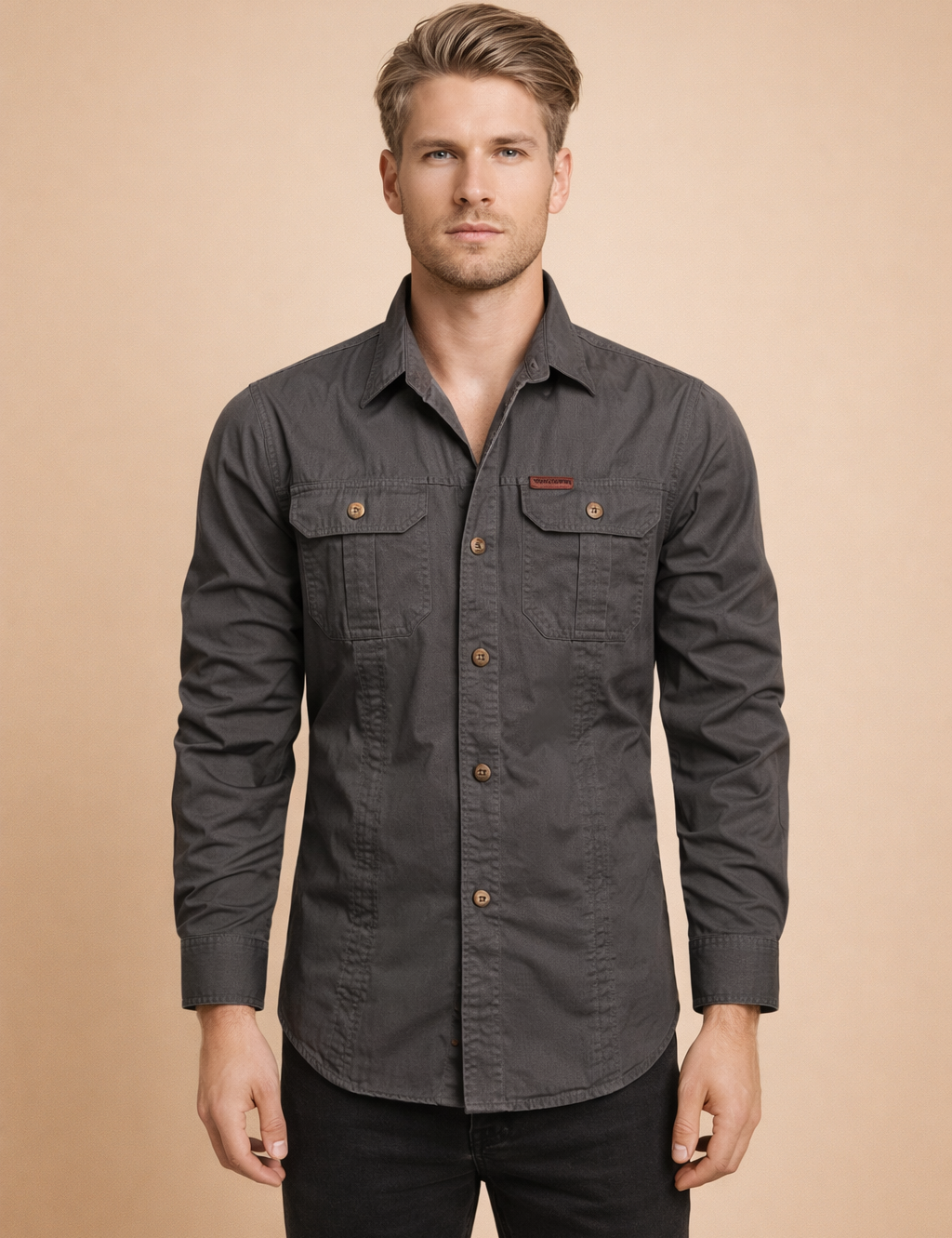 Long-sleeve button-down utility shirt with structured collar, dual chest flap pockets with button closures, straight hemline, reinforced seams, and matte woven fabric designed for a clean, tailored fit.