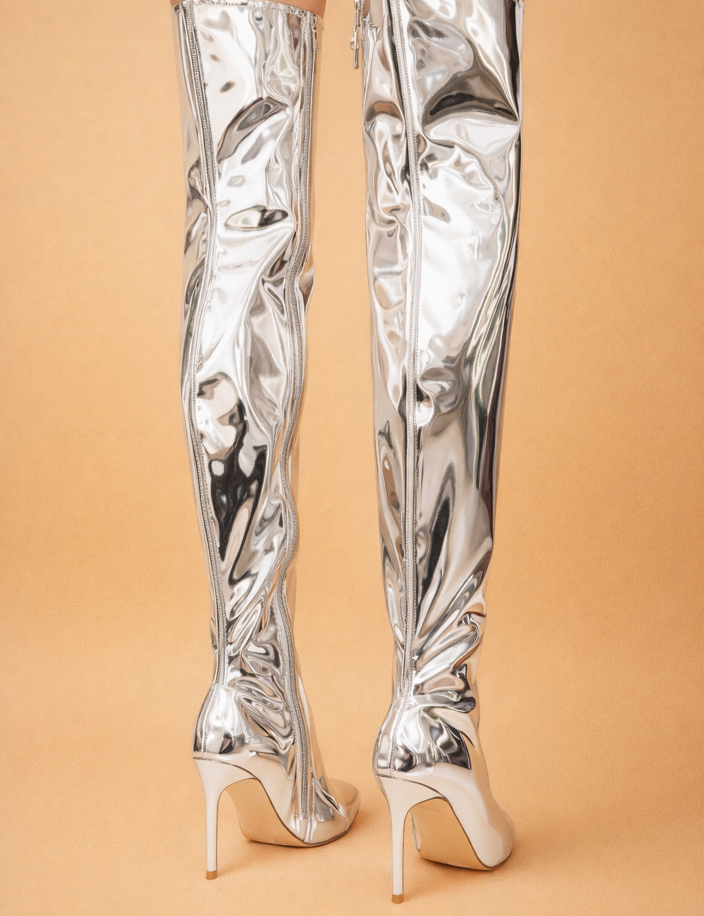 metallic-over-the-knee-boots-back-view-model-studio-pose-european-fashion-editorial.png
