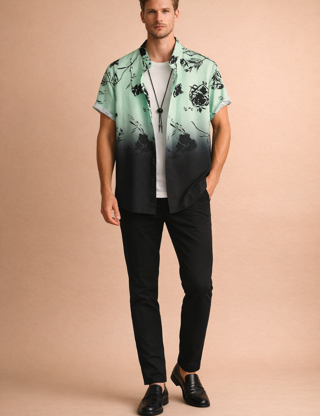 Mint green to black gradient short-sleeve button-up shirt with black floral print, worn open over a plain white crew-neck T-shirt, paired with slim black trousers and black leather loafers, featuring a smooth lightweight fabric with precise fade transition and sharp floral detailing.