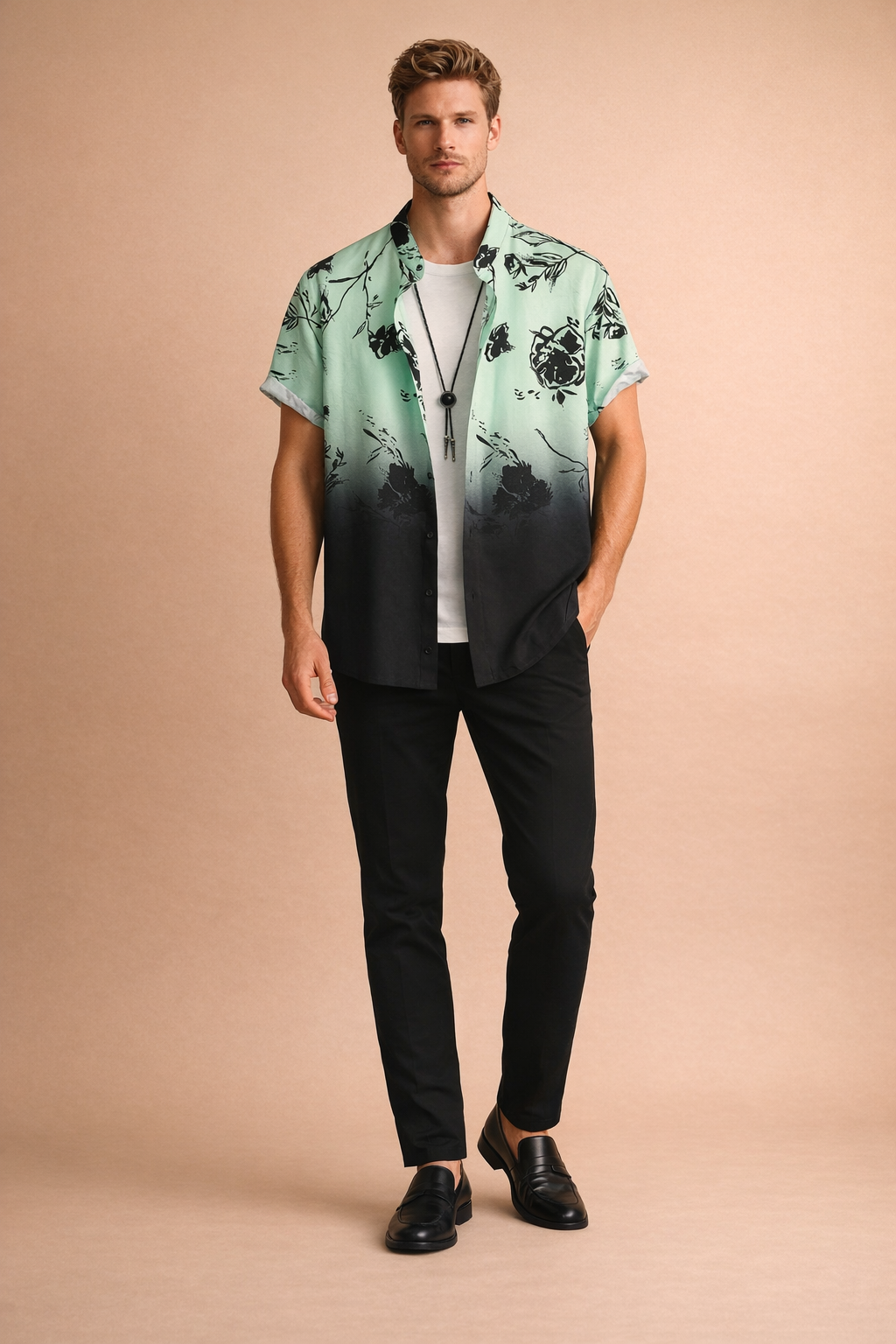 Mint green to black gradient short-sleeve button-up shirt with black floral print, worn open over a plain white crew-neck T-shirt, paired with slim black trousers and black leather loafers, featuring a smooth lightweight fabric with precise fade transition and sharp floral detailing.