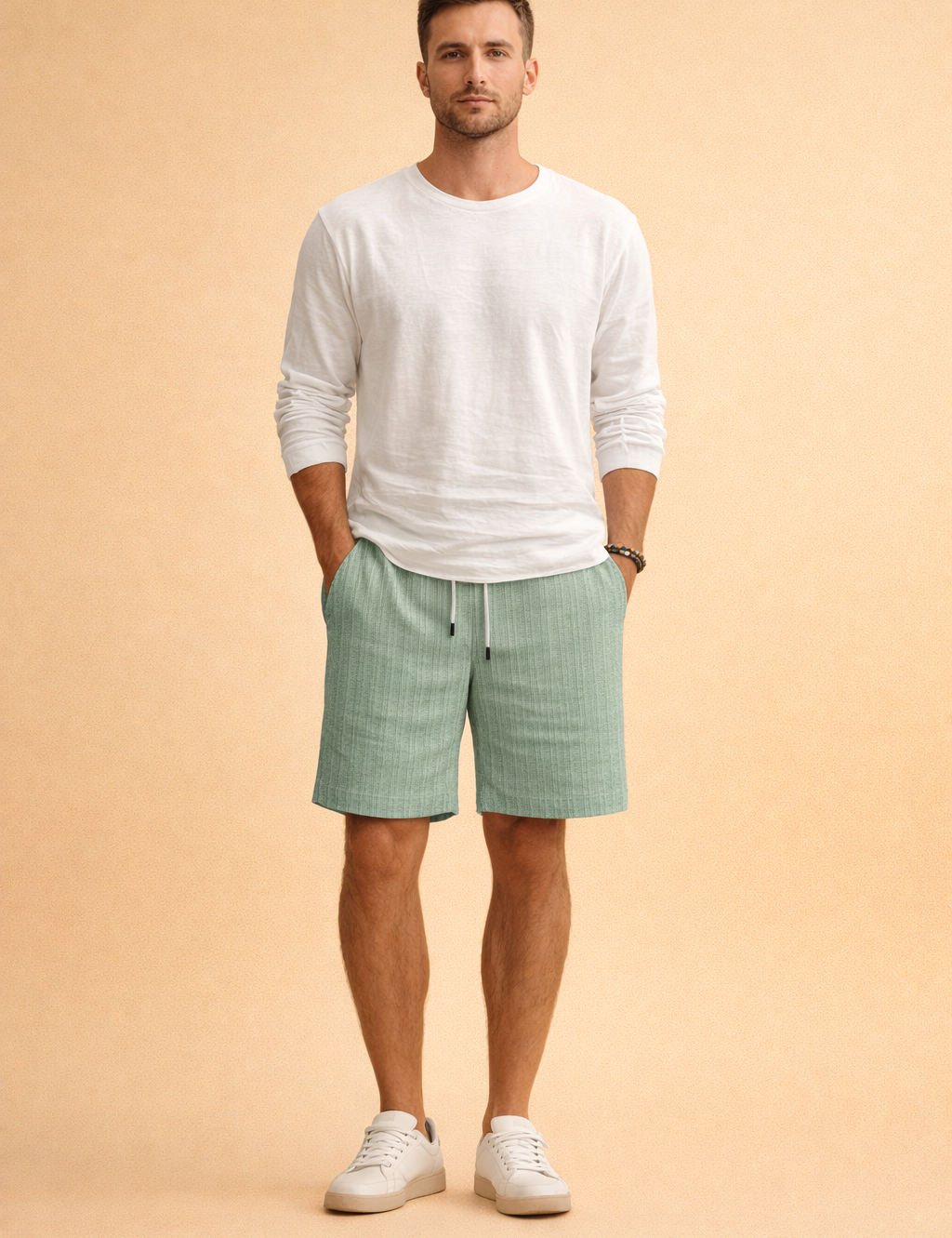 Mint green ribbed drawstring summer shorts paired with a clean white long-sleeve casual top and minimalist white low-profile sneakers, creating a relaxed yet refined warm-weather outfit with a lightweight textured finish and balanced proportions.