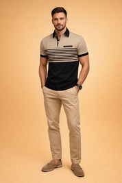 Short-sleeve mens polo shirt in beige and black color-block design with horizontal fine stripes across the chest, black collar with button placket, slim tailored fit, paired with beige slim-fit trousers and clean minimalist low-profile shoes for a refined modern casual look.