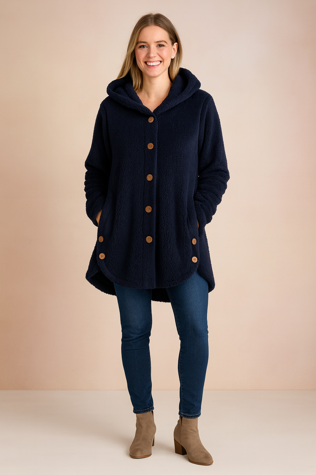 Navy Blue fleece hooded button-up jacket with front pockets, designed for women. Features a mid-thigh length, long sleeves, and cozy sherpa-style fabric for warmth and comfort