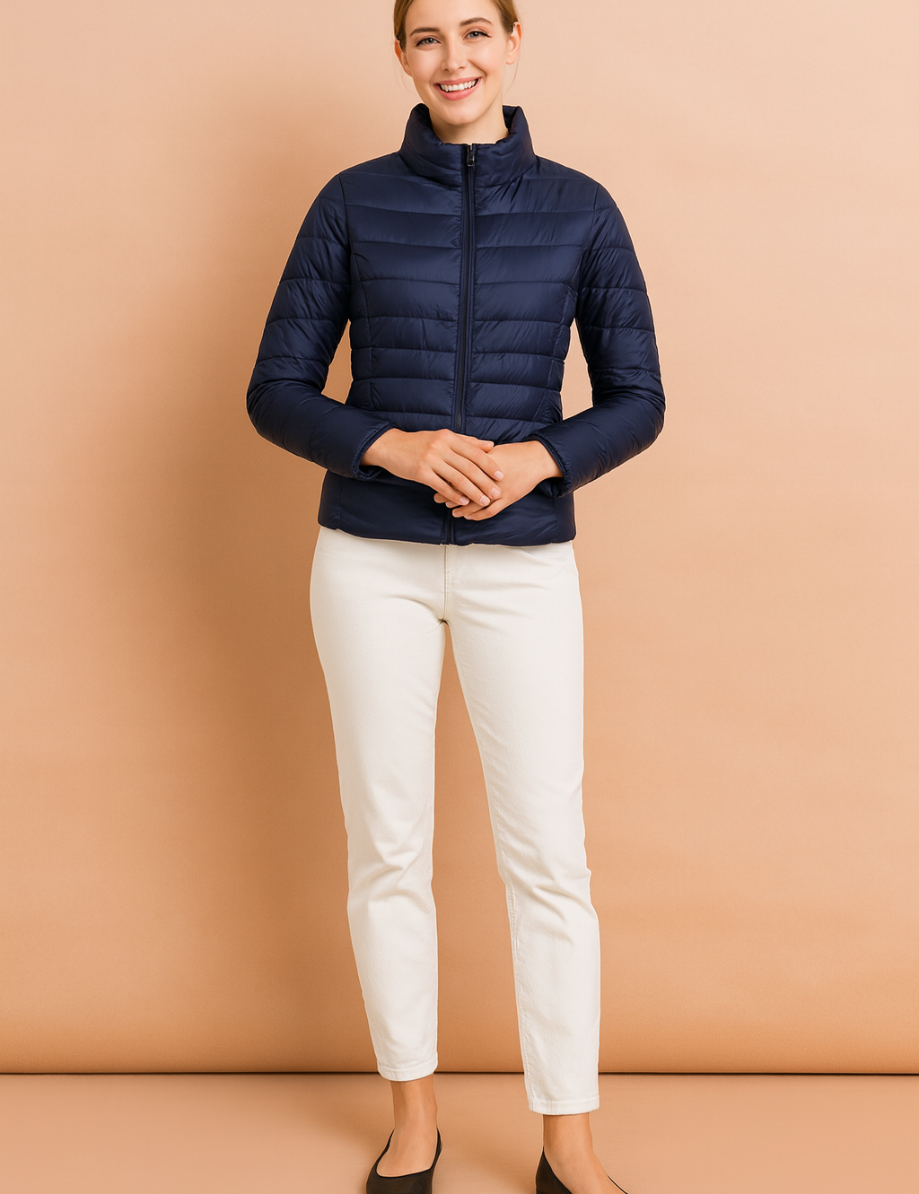 Women’s navy blue quilted puffer jacket with horizontal stitching, high collar, and front zip closure, styled with a slim fit