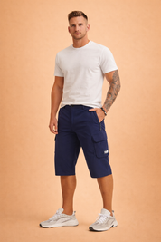 Men’s navy blue knee-length cargo shorts crafted from smooth technical polyester fabric, featuring a clean plain-weave texture, structured straight cut, front button closure with belt loops, zippered side pocket, and a flap-secured cargo pocket on the thigh, finished with a subtle stitched logo patch.