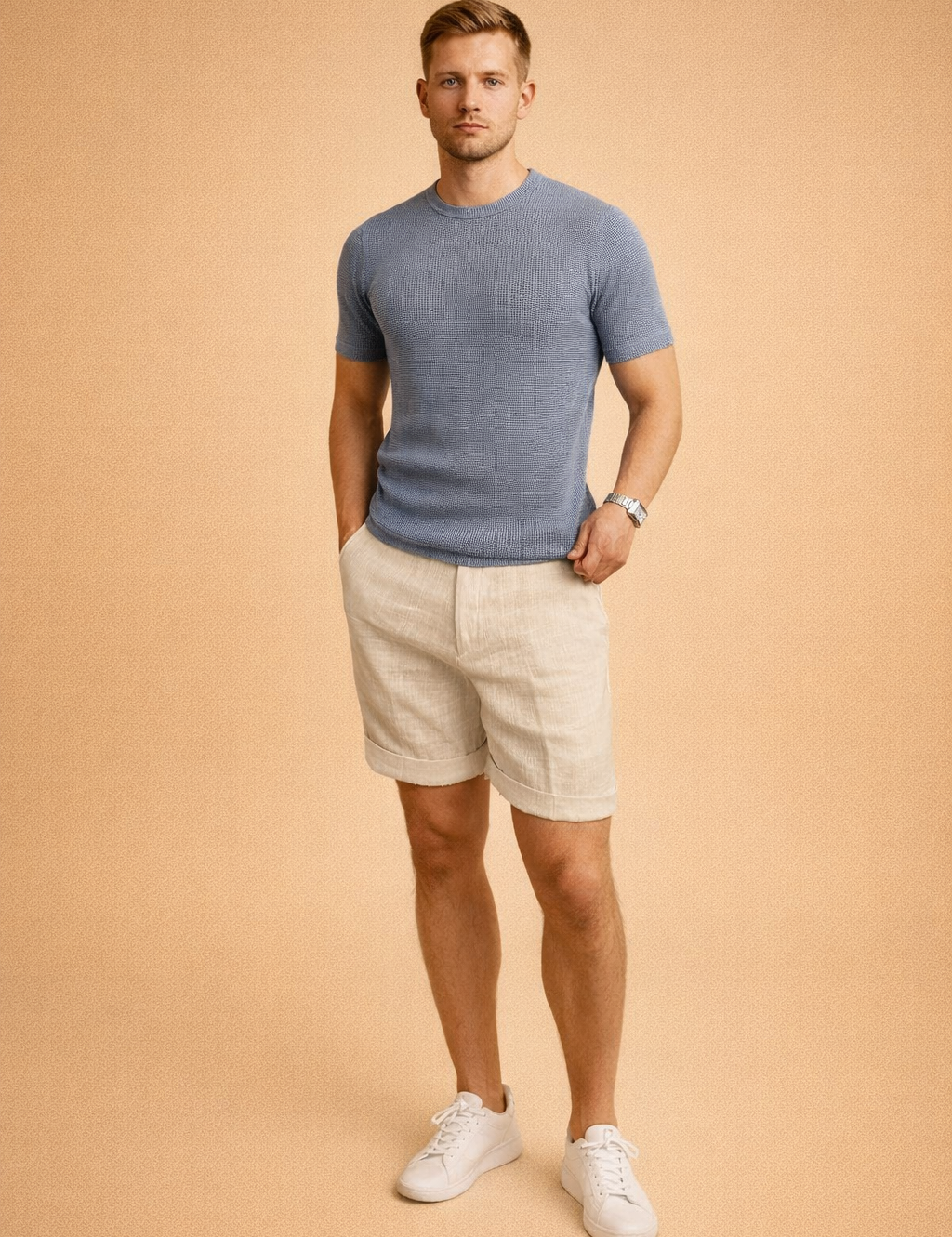 Off-white linen shorts with a lightweight woven texture and clean cuffed hems, paired with a taupe short-sleeve crew-neck T-shirt featuring a fine waffle knit pattern and smooth, matte finish, showcasing a relaxed yet refined summer outfit with natural fabric drape and neutral tones.